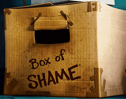 Despicable Me gif. Penny's hopeless little eyes peer out from the box of shame.