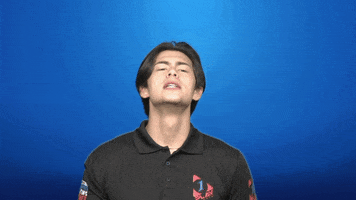 Video gif. Young man shakes his head side to side while saying, "Say whaat?!," which appears as floating text behind him. Faded, white question marks appear above his head.