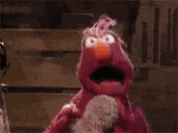 An animated gif of a Muppet running towards the camera with mouth open and eyes wide in panic. 