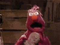 An animated gif of a Muppet running towards the camera with mouth open and eyes wide in panic.