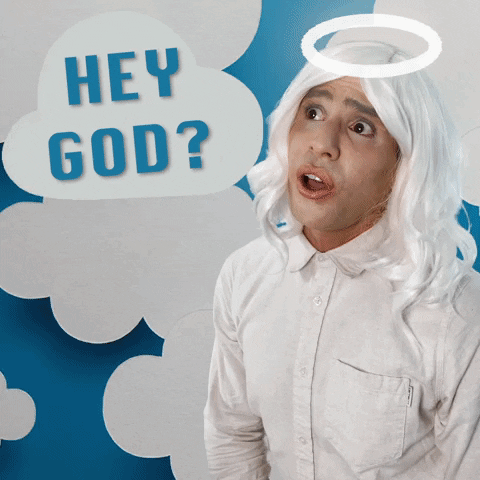 Celebrity gif. James Koroni with a white wig and cartoon halo over his head asks, "Hey God?" Cut to him as God wearing a long gray wig and long gray beard playing a video game. He stops irritatedly and says, "Ugh what?!" 