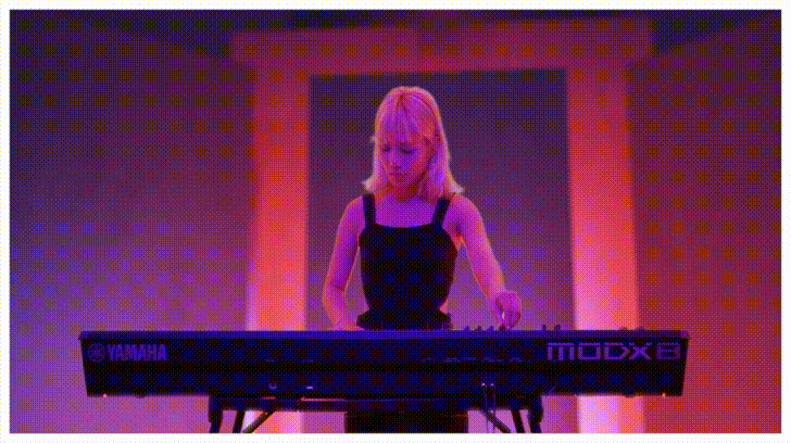 woman using yamaha piano