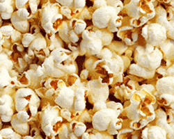 Video gif. A sea of popcorn moves down almost like a stream of water. 
