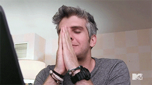 Reality TV gif. Max Joseph on Catfish The TV Show has his hands in a prayer position in front of his face. He has his eyes closed as he shakes his head in disbelief, and then looks over at the person next to him.