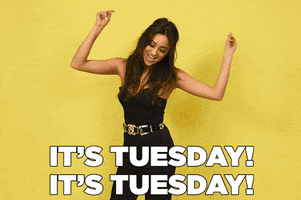 Celebrity gif. Shay Mitchell swings her hands above her head happily as she spins in a circle. Text, "It's Tuesday! It's Tuesday!"