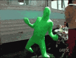 green man happy dance GIF
