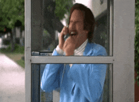Movie gif. Will Ferrell as Ron Burgundy from Anchorman has a crying, flailing breakdown in a "glass case of emotion", otherwise known as a phone booth.