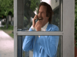Film gif.  Will Ferrell als Ron Burgundy uit Anchorman heeft een huilende, zwaaiende inzinking in een "glazen kast van emotie", ook wel bekend als een telefooncel.