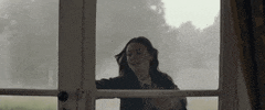 Movie gif. Amelia Crouch as Charlotte in The Cursed desperately tries to open a locked door. She pounds her open palms on the glass and screams, “help!”