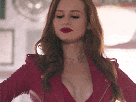 TV gif. Madelaine Petsch as Cheryl in Riverdale. She stands with her hands on her hips and looks at someone before boldly saying, "I'm in the mood for some hell-raising."