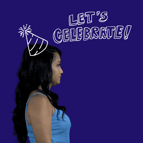 Video gif. Woman with an animated party hat blows a ribbony party horn, shooting out animated confetti, and then smiles back at us. Text, "Let's celebrate!"