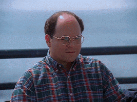 Seinfeld gif. Jason Alexander as George sits on bench on the pier, thinking. Slowly he stands up, and he walks and then runs through a flock of birds on the boardwalk, jacket in hand. 
