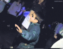 Animated GIF of a man dancing in a night club.