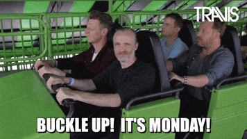 Celebrity gif. The band Travis takes off in a roller coaster, mouths dropping open as the ride jolts to a start. Text, "Buckle Up! It's Monday!"
