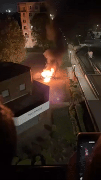 Police Vehicle Set Alight Outside Police Station in West Paris
