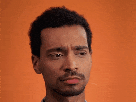 Ad gif. Man frowns, looking up and then at us, cocking his head to the side, while in the background various math formulas emerge and float around.