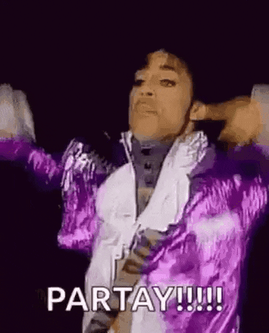 Celebrity gif. Wearing a trademark shiny purple jacket, Prince throws his hands up and exclaims: Text, "Partay!"