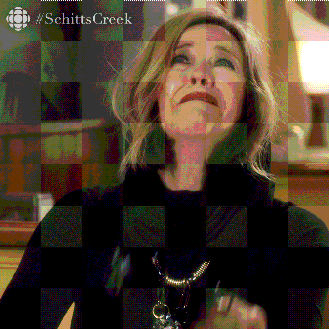 Schitt's Creek gif. Catherine O'Hara as Moira on Schitt's creek leans forward with tearfilled eyes and a cathartic smile as she yells, “F, I know!” with the F word bleeped out.