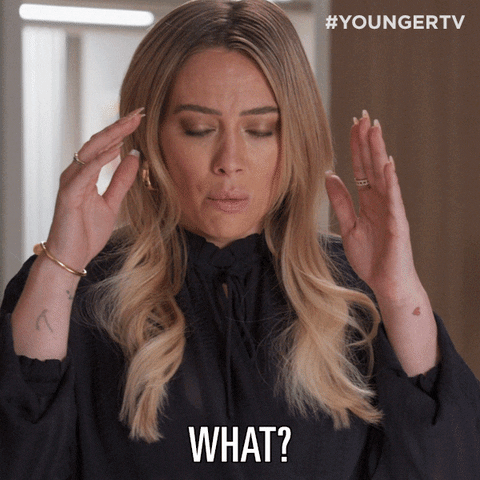 TV gif. Hilary Duff as Kelsey Peters on Younger holds her hands up and blinks super fast as if processing something crazy she just heard, and then looks down with angry eyes as she says, “What?”