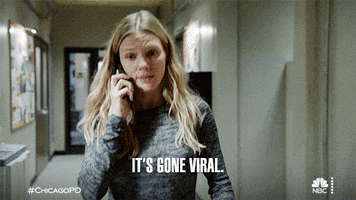 TV gif. In a scene from Chicago PD, a young woman walks along a hallway while on a phone call. Text, It's gone viral.