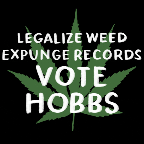 Digital art gif. Green marijuana leaf on a black background with a message in white marker font, "Legalize weed, expunge records, Vote Hobbs."