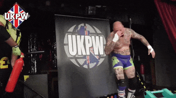 Dow Jones Fire Extinguisher GIF by United Kingdom Pro Wrestling