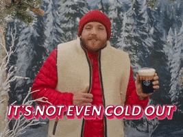 Ad gif. A man in a beanie and winter vest is standing in the snow and is holding an iced Americano from Starbucks. He's shivering but gives us a smile and the text reads, "It's not even cold out."