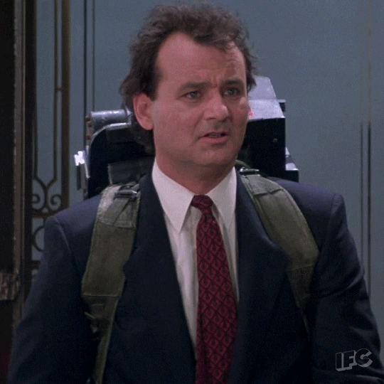Movie gif. Bill Murray as Dr. Venkman in Ghostbusters looks confused, then smiles and nods his head.