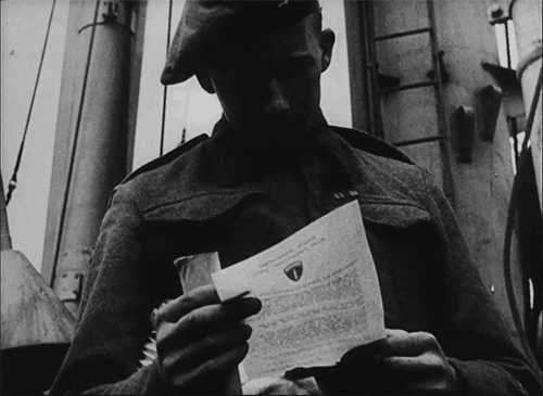 Animated gif of a man reading a letter.
