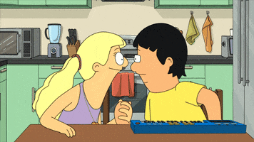 Cartoon gif. Gene and Courtney from Bob's Burgers sit at a table, holding hands, and leaning into each other for a kiss