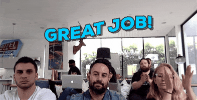 Video gif. Three people sit and smile as they look at us and clap cheerfully. Blue text waves over them, "Great job!"