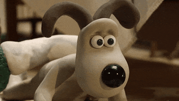 Stop motion gif. Gromit from Wallace and Gromit shakes his head, rolls his eyes, and puts his head in his paw. 