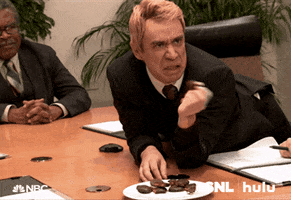 SNL gif. In a skit, Fred Armisen breaks a cookie he holds in his hand and says, “ew!”