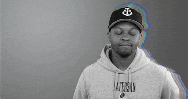 Celebrity gif. Rapper BJ the Chicago Kid shakes his head and covers his face, awkwardly disapproving.