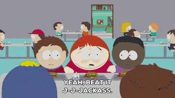 South Park gif. Craig and Token Black sit at a cafeteria table with others, looking towards the center between the two of them, where Clyde ashamedly picks up his food tray and walks away. Text, "Yeah, bit it j-j-jackass."