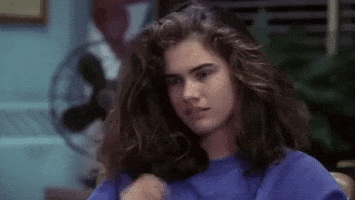 Movie gif. Heather Langenkamp as Nancy in A Nightmare on Elm Street rubs her eye and then her forehead as she rests her head on her hand.