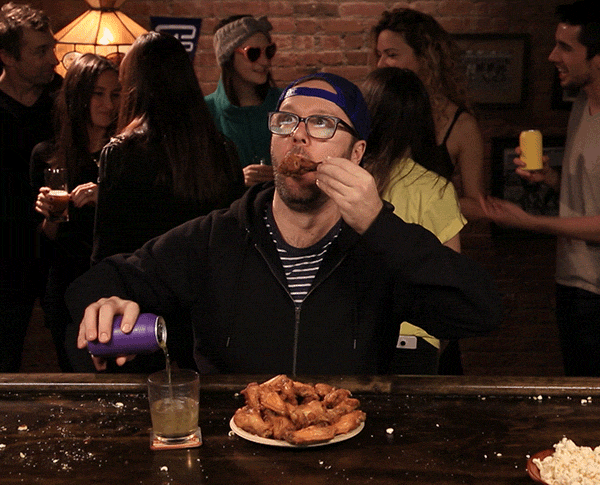Man in shock/disbelief slowly lowering his chicken wing. 'The Resident' season 2 premiere.