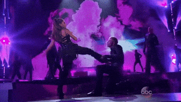 kicking ariana grande GIF by Billboard Music Awards