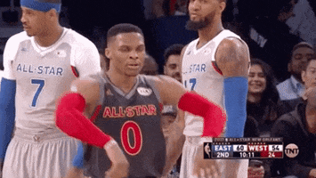 Sports gif. Russell Westbrook struts confidently at the NBA All-Star game.