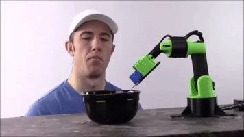 slantconcepts food robot robot food robot cereal robot feed person GIF