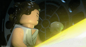 Disney gif. Luke Skywalker and Rey in Lego Star Wars Holiday Special nod fiercely as they hold up their lightsabers.