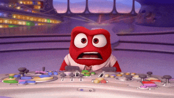 Cartoon gif. Anger from Inside Out is at the control table and he flares up, flames bursting out from his head.