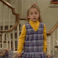 TV gif. Lily Nicksay as Morgan in Boy Meets World throws her hands on her face as she screams. 