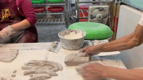 People making sweet potato balls.