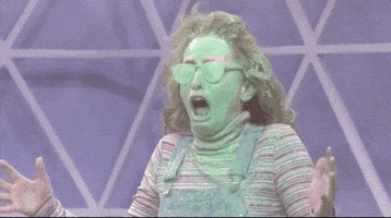 SNL gif. Sarah Sherman plays a kid on Nickelodeon that gets covered in gooey green slime all over her face and glasses. She opens her mouth in horror, shaking up and down, before yelling, "Why'd they do it to me?" which appears as text.
