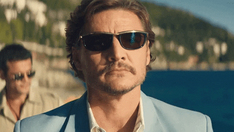 Movie gif. Pedro Pascal as Javi in The Unbearable Weight of Massive Talent puts his closed fist to his flat palm and nods.