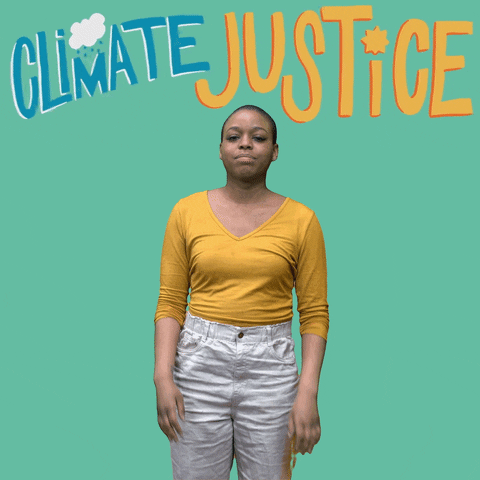Digital art gif. Woman seen from the knees up mouths and signs, "Climate justice now" in A-S-L. Above her head, the words "Climate justice now" appear in large, all-caps cartoon letters, with illustrations of clouds, the sun and the Earth, all against a teal background.