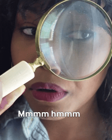 woman holding a magnifying glass