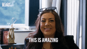 Reality TV gif. A contestant on "Made Up in Belfast" is sitting for an interview and smiling as she says, "This is amazing!'