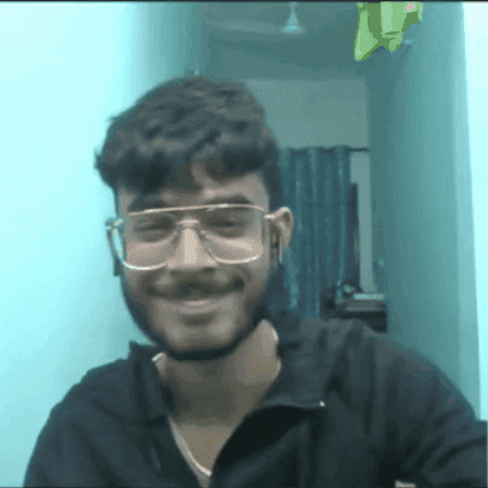 Video gif. A man in glasses holds up a rose to us while wiggling his eyebrows and giving us a closed-mouthed smile. Text, "Lo ga*d me daal lo."